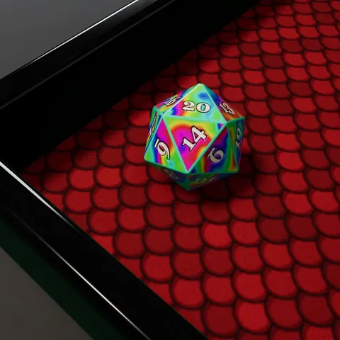 The Wild Card set: a die of swirling colours on red dragonscale in a black glass tray